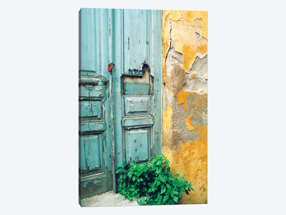 Red lock on a weathered blue door. by Tom Haseltine 1-piece Canvas Art Print