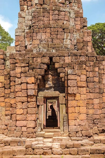 Thailand. Phimai Historical Park. Ruins of ancient Khmer temple complex. Buddha statue. by Tom Haseltine framed canvas print