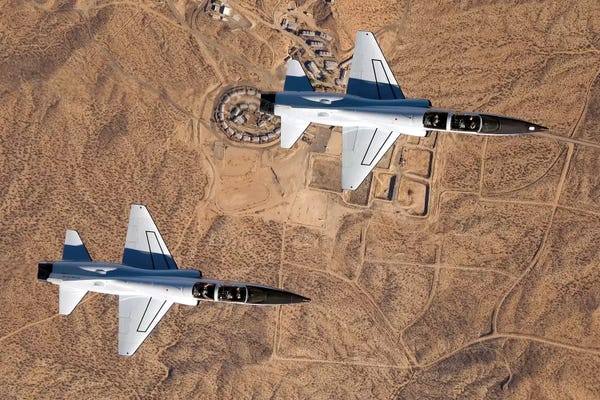 Military Aircraft: Two T-38A Mission Support Aircraft Fly In Tight Formation by Stocktrek Images