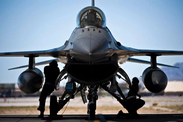 Air Force: US Air Force Crew Chiefs Do Pre-Flight Checks Under An F-16 Fighting Falcon by Stocktrek Images