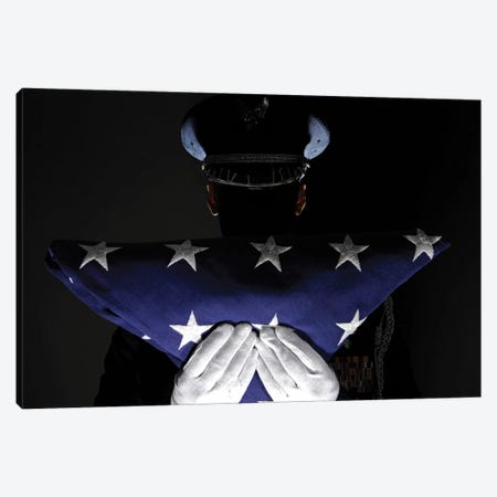 US Airman Stands At Attention After Completing The Flag Dressing Sequence Canvas Print #TRK1011} by Stocktrek Images Art Print