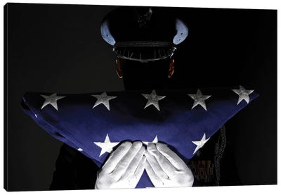 US Airman Stands At Attention After Completing The Flag Dressing Sequence Canvas Art Print - Air Force