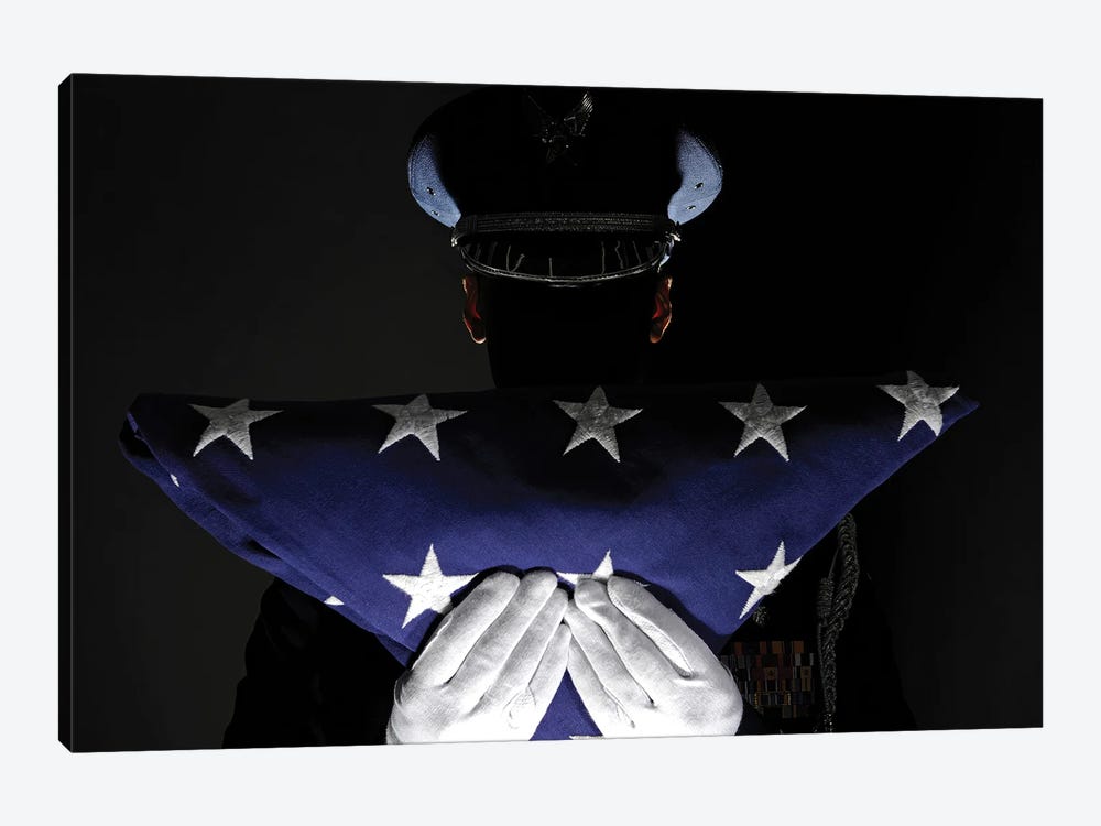 US Airman Stands At Attention After Completing The Flag Dressing Sequence 1-piece Canvas Print