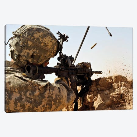 US Army Soldier Engages Enemy Forces In A Small Arms Fire Fight In Afghanistan Canvas Print #TRK1017} by Stocktrek Images Canvas Artwork