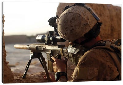 US Marine Looks Through The Scope Of His M16A4 Rifle For Enemy Forces Canvas Art Print