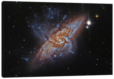 A Pair Of Overlapping Spiral Galaxies (NGC 3314) Canvas Art Print