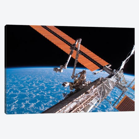 The Canadarm2 And Solar Array Panel Wings On The International Space Station Canvas Print #TRK1710} by Stocktrek Images Canvas Wall Art