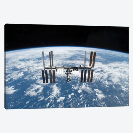 The International Space Station In Orbit Above Earth Canvas Print #TRK1722} by Stocktrek Images Art Print