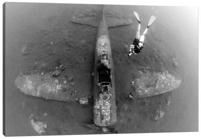 Diver Explores The Wreck Of A Mitsubishi Zero Fighter Plane Canvas Art Print