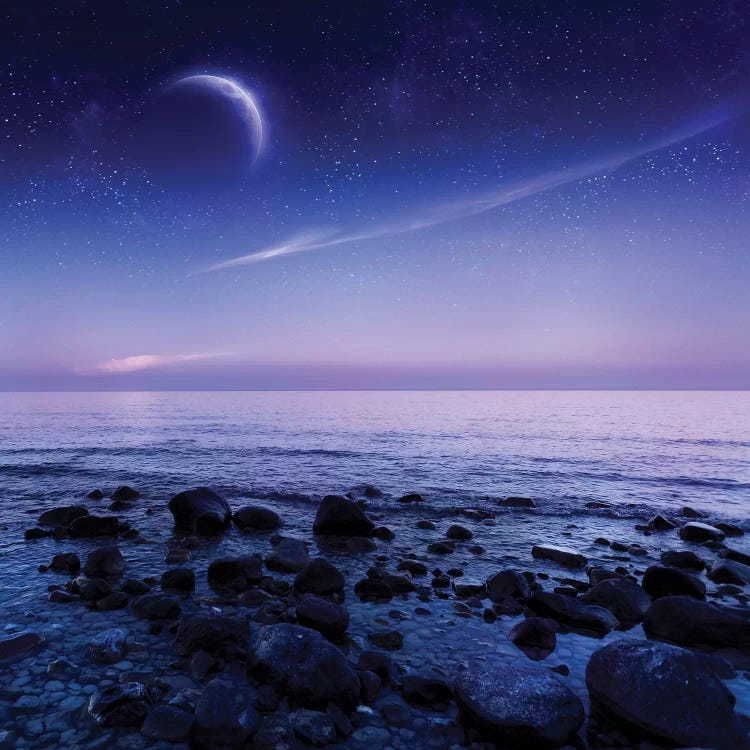 Moon Rising Over Rocky Seaside Against Starry Sky.