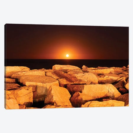 The Moon Rising Behind Rocks Lit By A Nearby Fire In Miramar, Argentina Canvas Print #TRK2654} by Luis Argerich Canvas Artwork