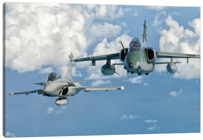 A Dassault Rafale Of The French Air Force Flys Alongside An Embraer A-1B Of The Brazilian Air Force Canvas Art Print