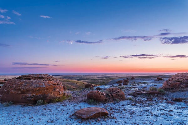 Crescent Moon In The Twilight Sky At Red Rock Coulee, Alberta, Canada.