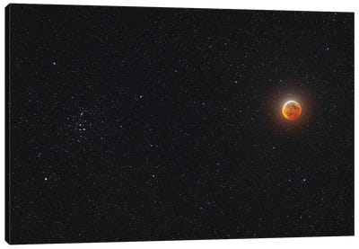 Eclipsed Moon Beside The Beehive Star Cluster. Canvas Art Print - Alan Dyer