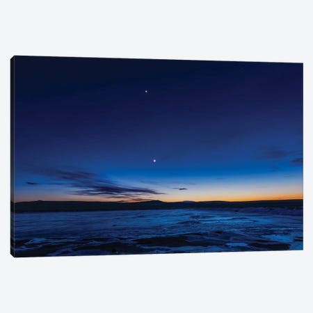 The Waxing Crescent Moon With Earthshine And Venus Over An Icy Pond In Alberta, Canada. Canvas Print #TRK3278} by Alan Dyer Canvas Art