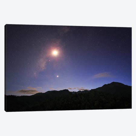 The Milky Way And Waxing Crescent Moon Shine Above The Mountain In Pai, North Of Thailand. Canvas Print #TRK3353} by Jeff Dai Canvas Art Print