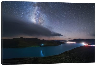 The Milky Way Shines Among The Passing Clouds Above Yamdrok Lake, Tibet, China Canvas Art Print - Jeff Dai