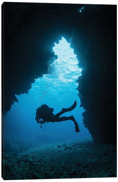A Diver Exiting A Swim Through Cavern, Kadavu Island, Fiji Canvas Art Print - Brook Peterson