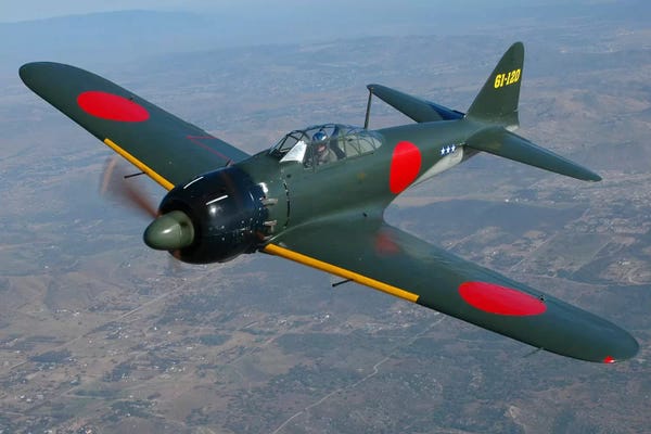 Military Aircraft: A6M Japanese Zero Flying Over Chino, California by Phil Wallick