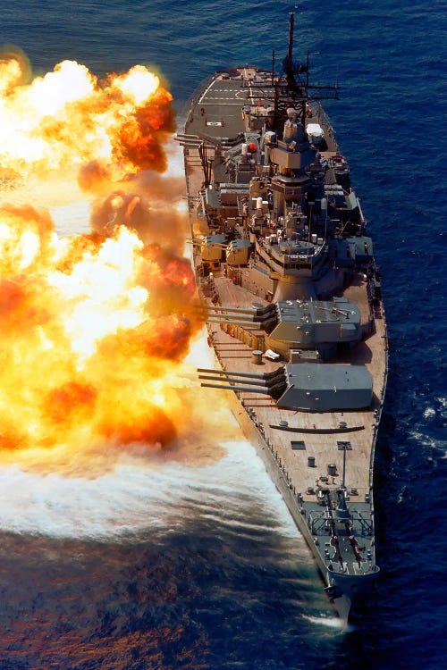 The Battleship Uss Iowa (Bb-61) Firing Its Mark 7 50-Caliber Guns Off The Starboard Side