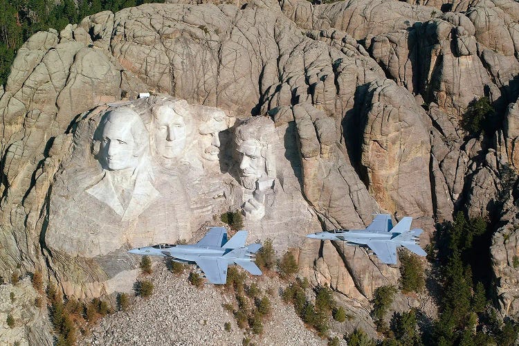 Two F/A-18E Super Hornets Conduct A Fly By Of Mount Rushmore During Training Exercise.