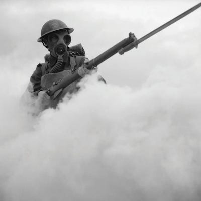 British Soldier Advancing Through A Smoke-Screen With Bayoneted Rifle During Wwii by Vernon Lewis Gallery canvas print