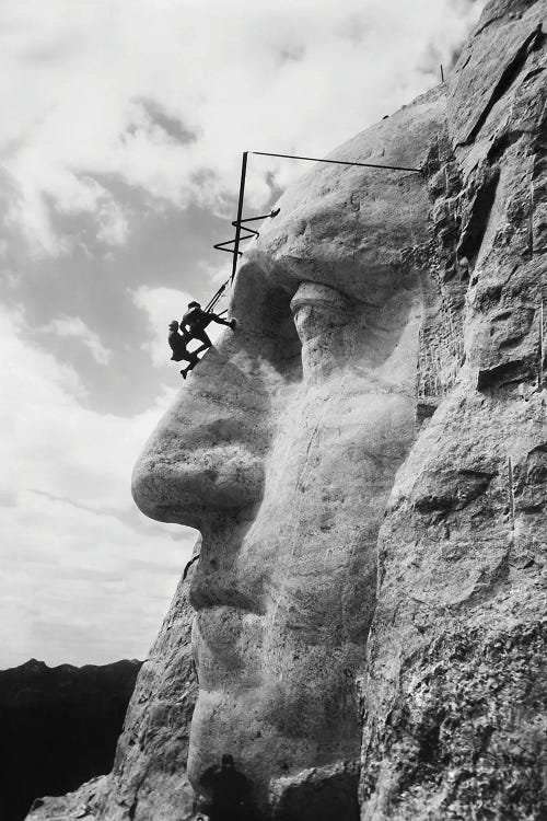 Gutzon Borglum Inspecting Work On The Face Of President Washington, Mt Rushmore, South Dakota by Vernon Lewis Gallery wall art