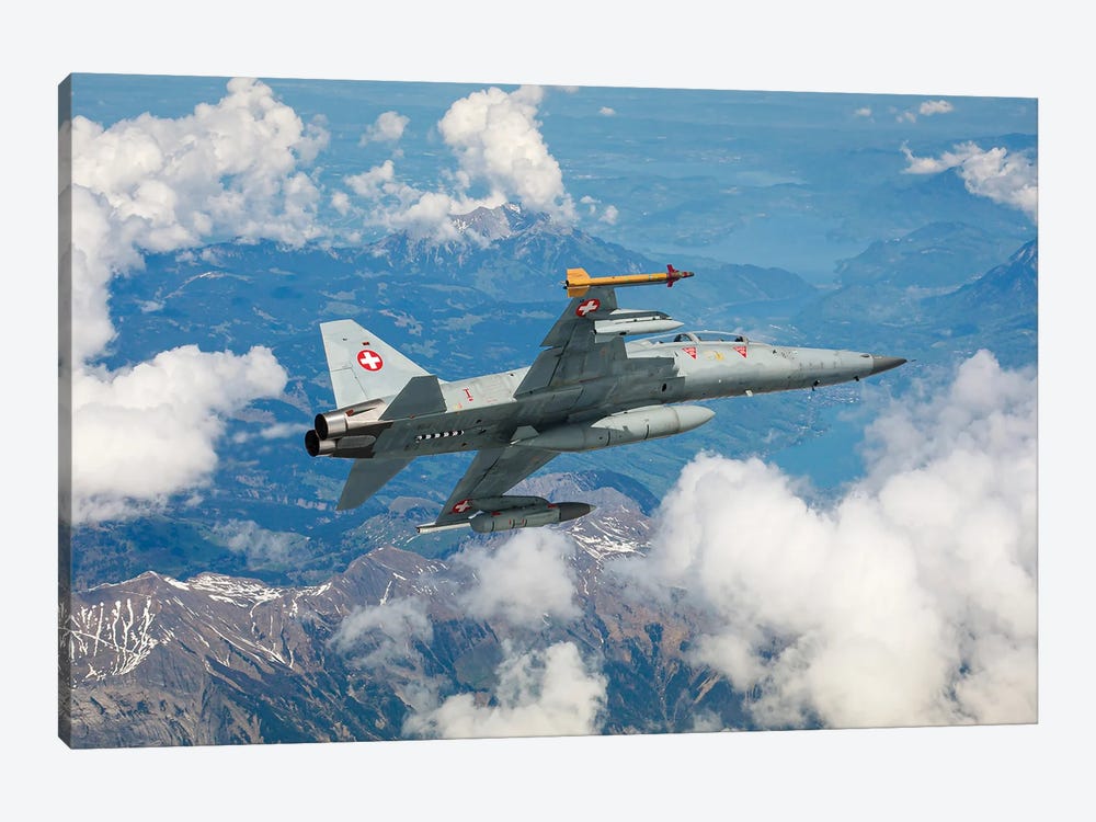A Swiss Air Force F-5F Tiger II Flying Over The Outskirts Of The Swiss Alps by Dirk Jan de Ridder 1-piece Canvas Wall Art