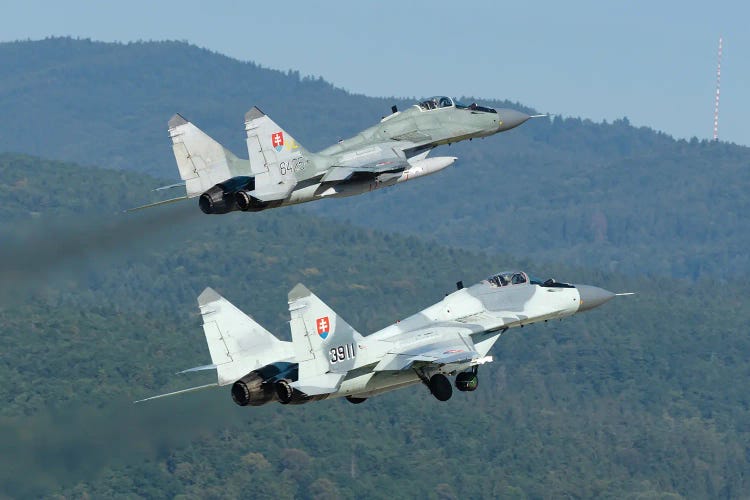 A Pair Of Slovak Air Force Mig-29As Scrambling For Quick Reaction Alert Mission by Simone Marcato wall art