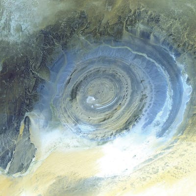The Richat Structure, A Prominent Circular Geological Feature In The Sahara Desert Of Mauritania by Stocktrek Images canvas print