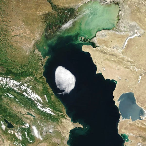 Stocktrek Images: A Lone Cloud With Well-Defined Edges Hovers Over Part Of The Caspian Sea by Stocktrek Images