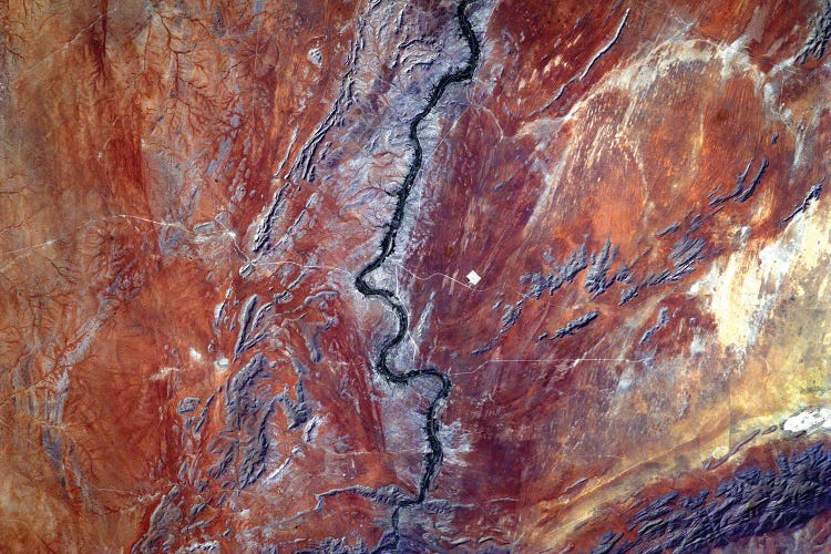 View From Space Of Sand Dunes, Ancient Rocks And The Orange River In The Kalahari Desert, Africa by Stocktrek Images wall art