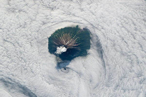 View From Space Of Atlasov Island Rising Above The Clouds And The Sea Of Okhotsk