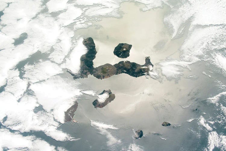 View From Space Of Several Of The Galapagos Islands Between Cloud Cover And Sunglint