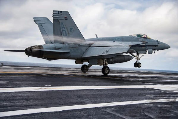 An F/A-18E Super Hornet Conducts A Touch-And-Go Landing Aboard USS Dwight D. Eisenhower