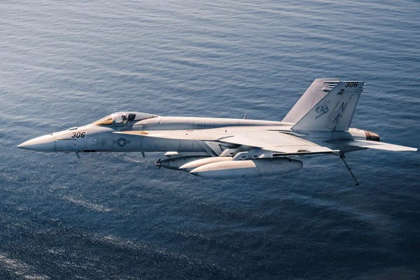 Military Aircraft: An F/A-18E Super Hornet During Flight Operations From The Aircraft Carrier USS Theodore Roosevelt by Stocktrek Images