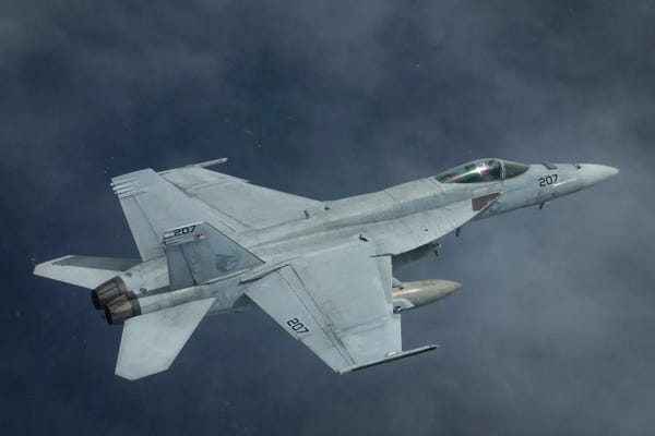 Military Aircraft: An F/A-18E Super Hornet Flies Over The Philippine Sea by Stocktrek Images