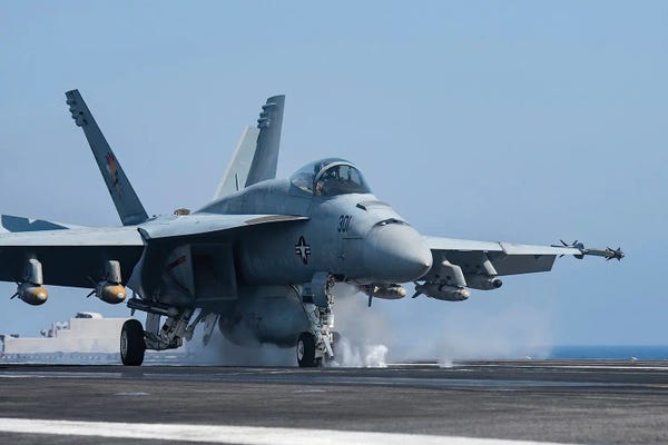 Military Aircraft: An F/A-18E Super Hornet Launches From An Aircraft Carrier by Stocktrek Images