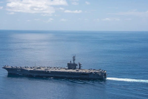 Warships: The Aircraft Carrier USS Carl Vinson Transits The Indian Ocean by Stocktrek Images