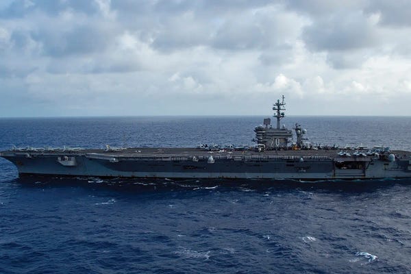 Warships: The Aircraft Carrier USS Carl Vinson Transits The Pacific Ocean I by Stocktrek Images