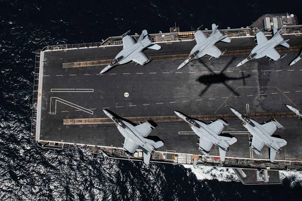 The Aircraft Carrier USS Theodore Roosevelt Transits The Pacific Ocean