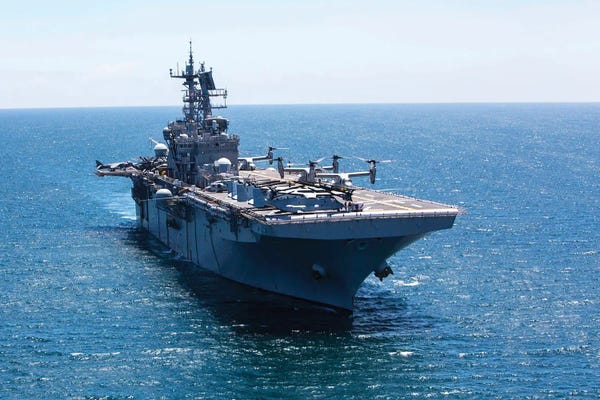 Warships: The Amphibious Assault Ship USS Iwo Jima In The Atlantic Ocean by Stocktrek Images