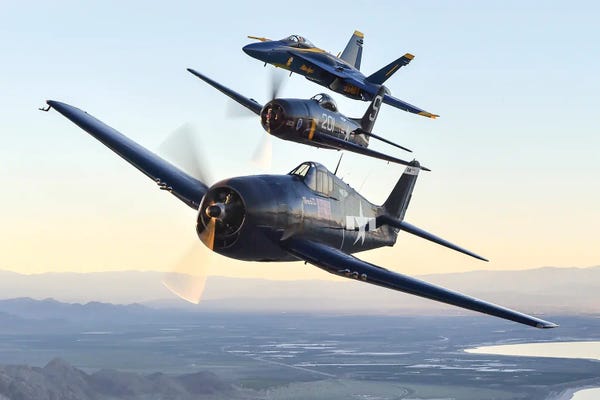 Military Aircraft: The Blue Angels Participate In A Heritage Flight Alongside An F6F Hellcat And F8F Bearcat I by Stocktrek Images