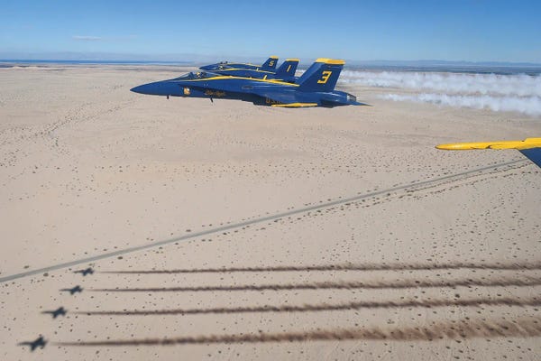Military Aircraft: The Blue Angels, Conduct A Training Flight Over El Centro, California I by Stocktrek Images