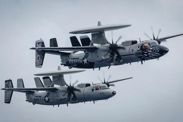 Military Aircraft: Two E-2C Hawkeye Early Warning And Control Aircraft In Flight by Stocktrek Images