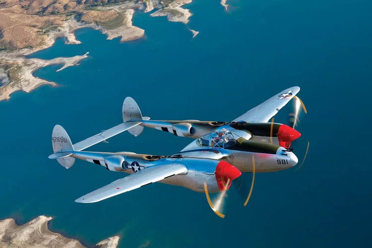 A Lockheed P-38 Lightning Fighter Aircraft In Flight II by Scott Germain wall art