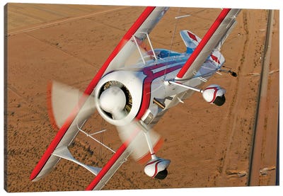 A Pitts Model 12 Biplane In Flight Canvas Art Print