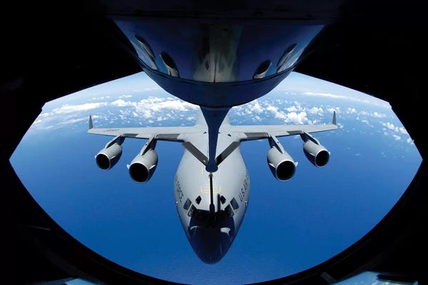 Stocktrek Images: A C-17 Globemaster III Receives Fuel From A KC-135 Stratotanker by Stocktrek Images