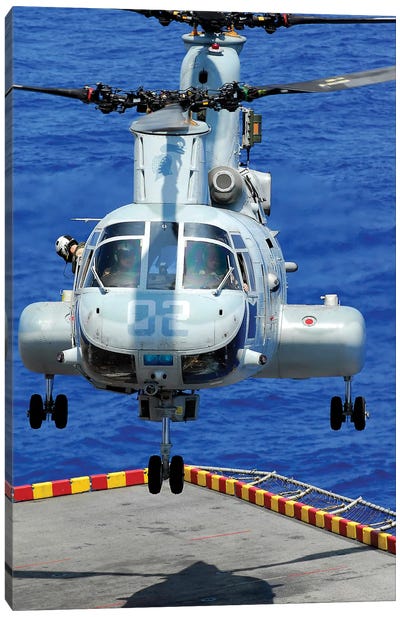 A CH-46E Sea Knight Helicopter Prepares To Land On The Flight Deck Of USS Peleliu Canvas Art Print - Helicopter Art