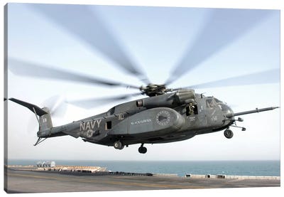 A CH-53 Sea Stallion Helicopter Leaves The Flight Deck Of USS Kearsarge Canvas Art Print